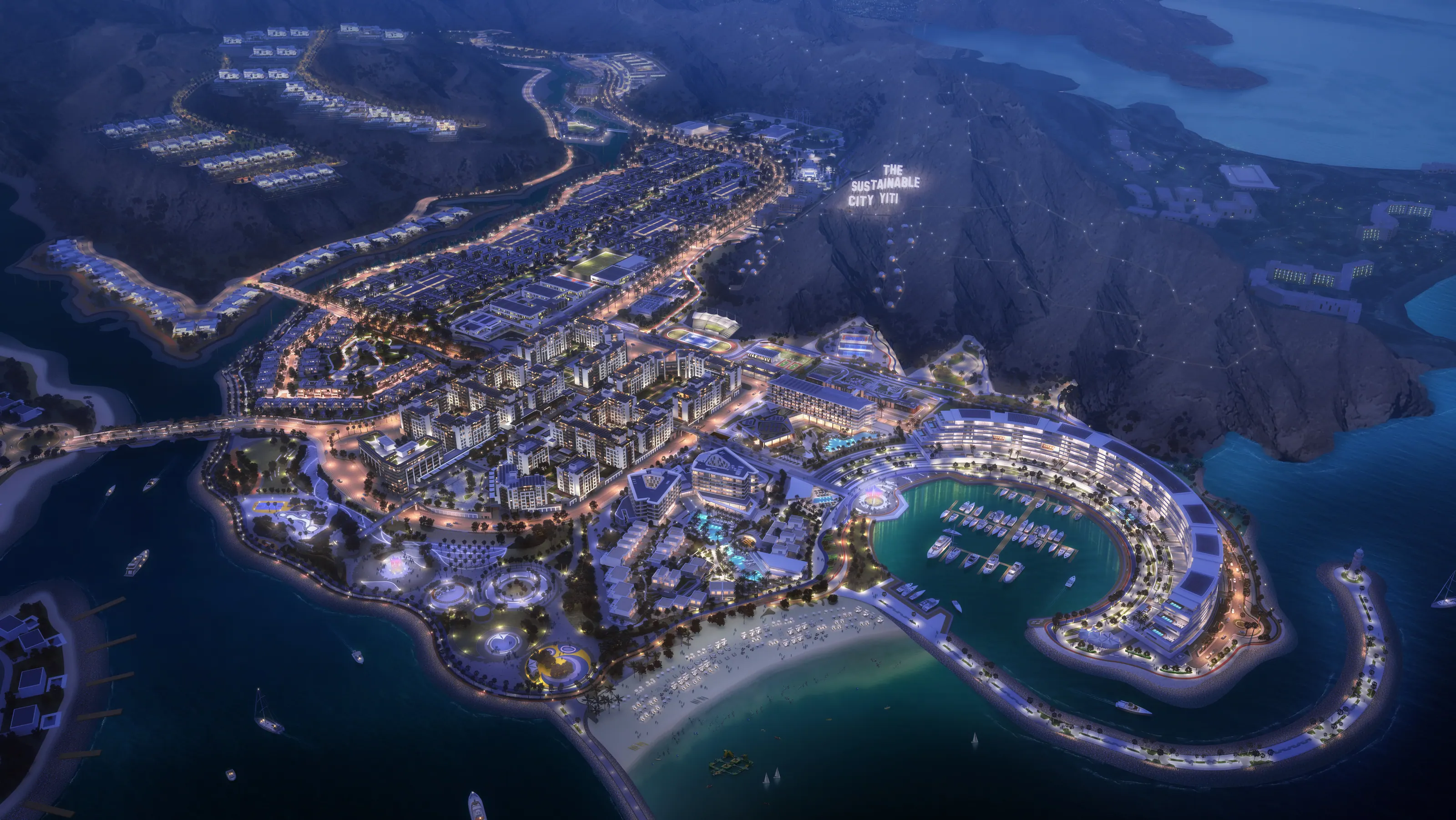 The Sustainable City, Yiti at blue hour: the community lit from the hillside villas to the marina, with the city name illuminated on the mountainside