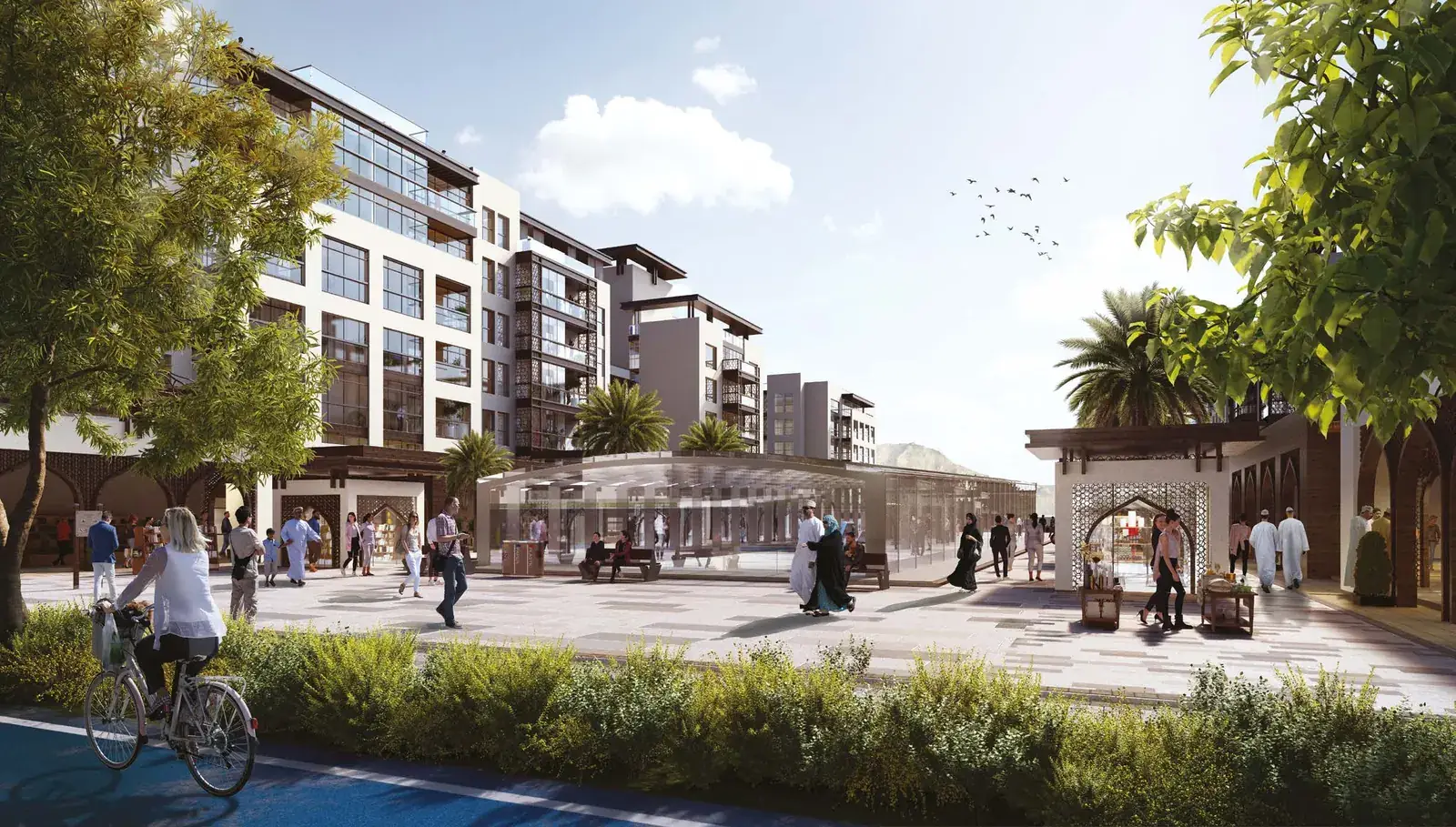 Two bedroom apartment buildings lining a planted pedestrian street at The Plaza