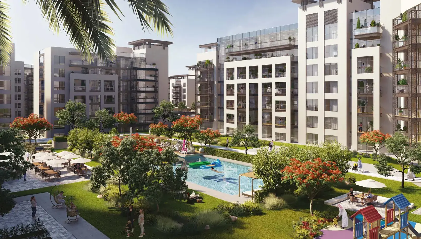 Three bedroom apartment buildings at The Plaza beside a landscaped pool garden